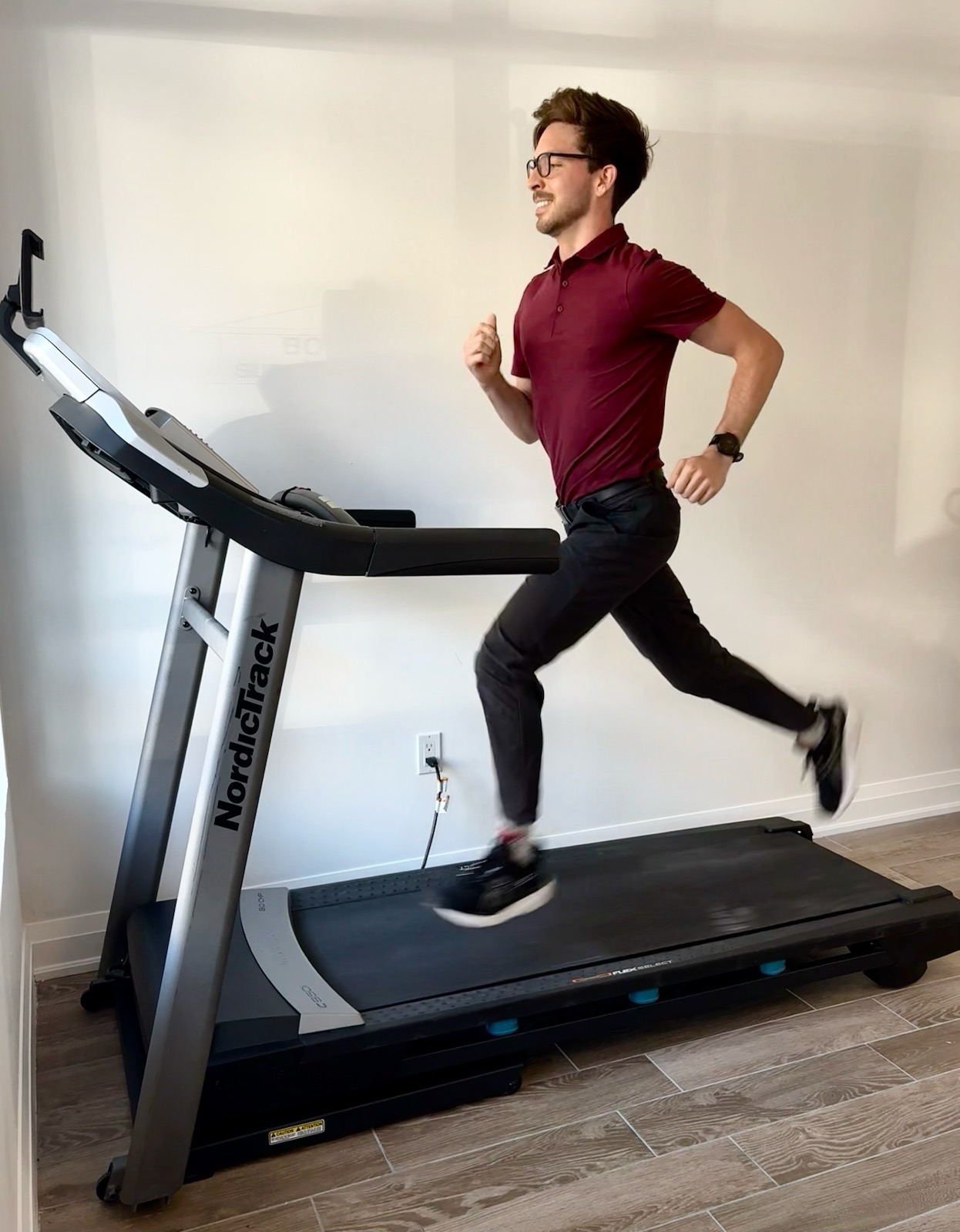 Dr. Caleb Beland running on a treadmill for a gait assessment at Sunshine Wellness in Oakville